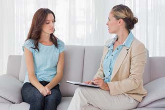 Woman listening to her psychologist